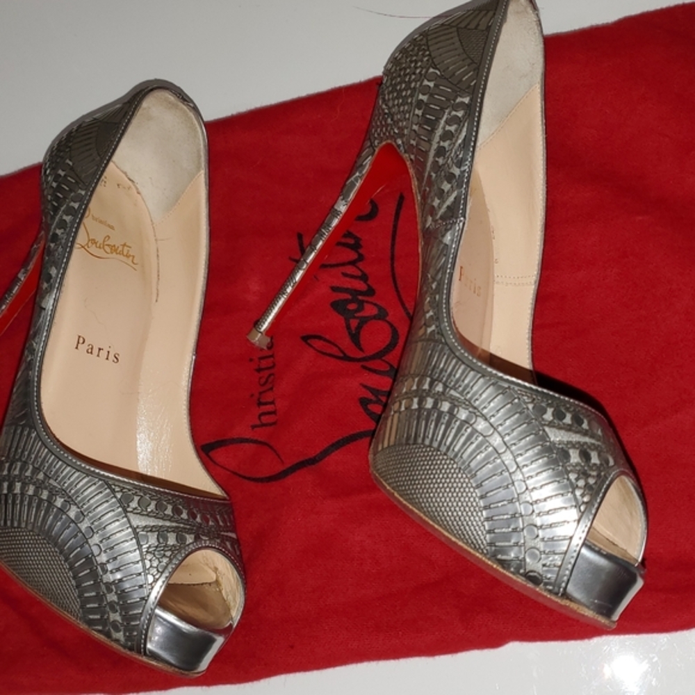 Christian Louboutin gray Metallic high heel shoes.